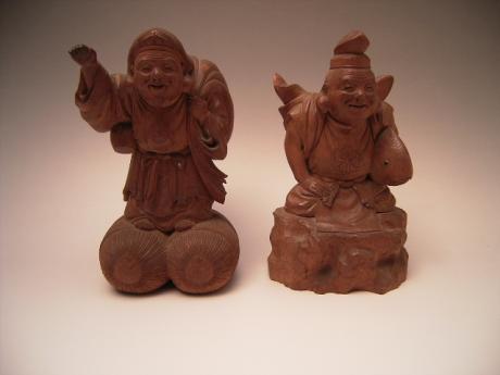 JAPANESE LATE MEIJI PERIOD CHERRYWOOD CARVINGS OF DAIKOKU AND EBISU, SIGNED<br><font color=red><b>SOLD</b></font>