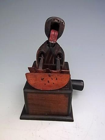 JAPANESE EARLY 20TH CENTURY KOBE TOY - DOUBLE HANDED MELON EATER<br><font color=red><b>SOLD</b></font> 
