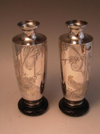 JAPANESE CIRCA 1900 PAIR OF PURE SILVER CHISELED VASES SIGNED BY YUKITERU<br><font color=red><b>SOLD</b></font>